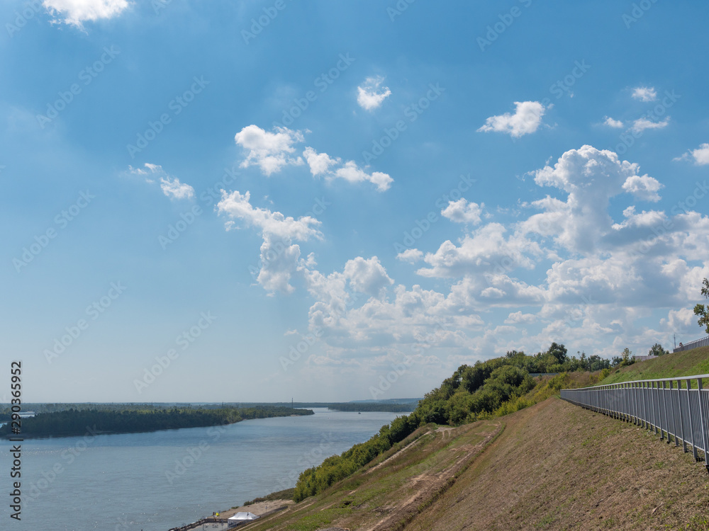 Landscape river in a forest with floating motorboats Landscape river in a forest with floating motorboats