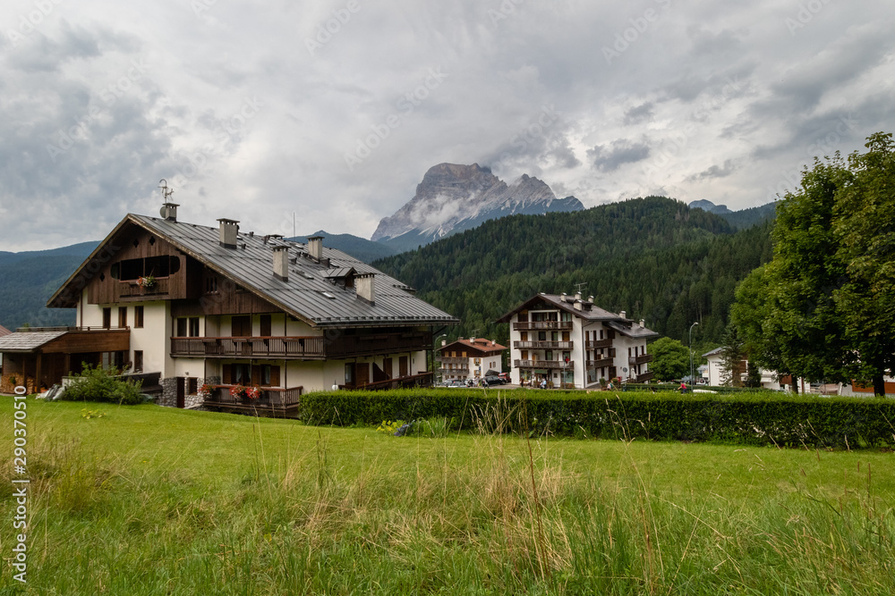 Cozy Alpine Buildings in Dolomite Alps mountains in Italy. Cordtina de Ampezzo, Italy
