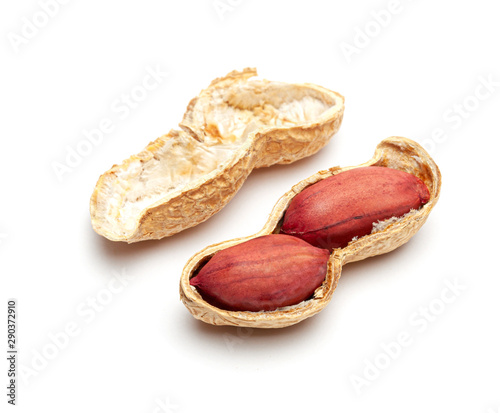 Dried peanuts in peel closeup isolated on white background