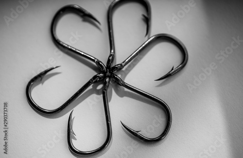 Sharp big fishing hooks on a white background photo