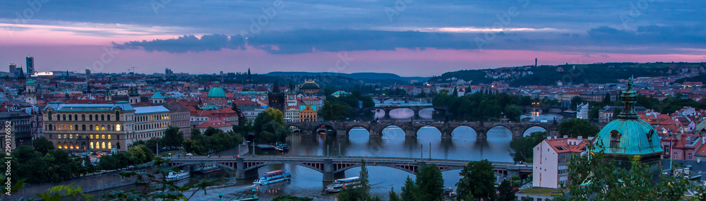 Night view of bridges on the Vltava river and historical center of Prague