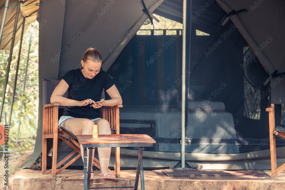 Woman resting in camping during her travelling concept for travel lifestyle and eco tourism Woman resting in camping during her travelling concept for travel lifestyle and eco tourism
