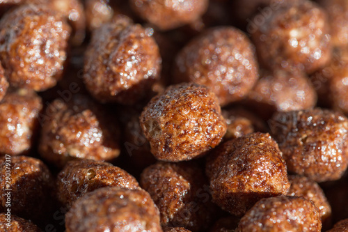 Chocolate cereal balls, background as food © donikz