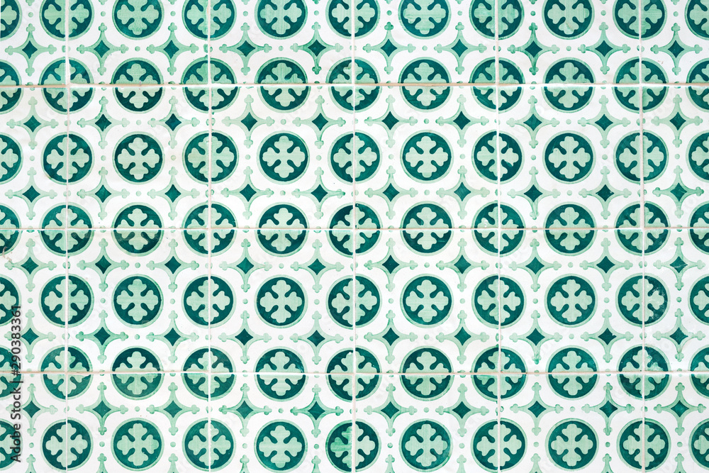 Traditional ornate portuguese decorative tiles azulejos in white and green colours.