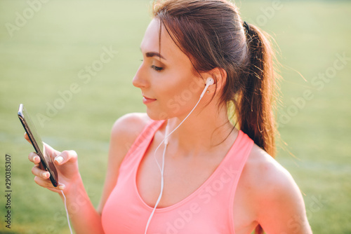 beautiful girl sporting appearance running. Girl running on sunset background