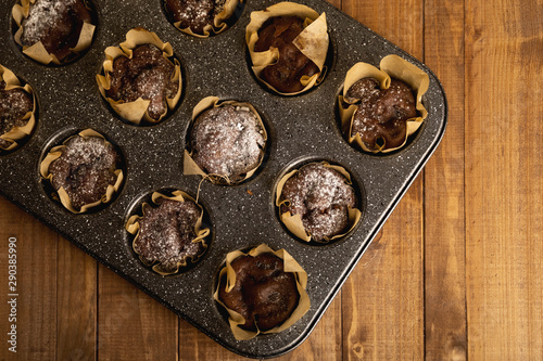 Baking tin with a tasty chocolate muffins