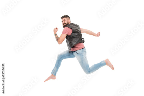 Feeling so energetic. Active and energetic hipster in photo studio. Bearded man running fast with energetic and powerful moves. Energy and energetic activity
