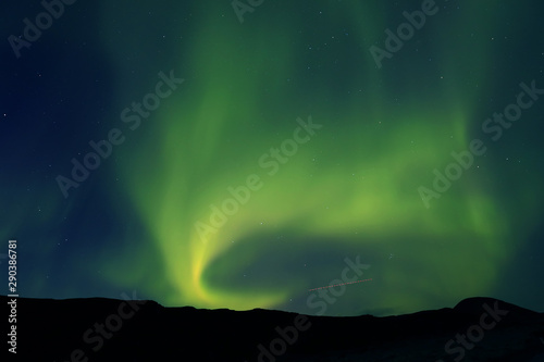 Aurora Borealis against the sunset sky in Iceland, Europe © Rechitan Sorin