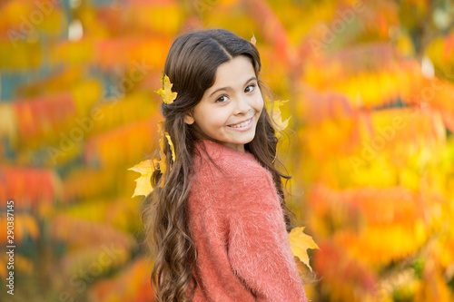 Cozy autumn day. Play with leaves. Happy childhood. Fall festival. Simple happiness. Kid enjoy autumn outdoors. Meet autumn. Little girl smiling happy cute child gorgeous long hair maple leaves