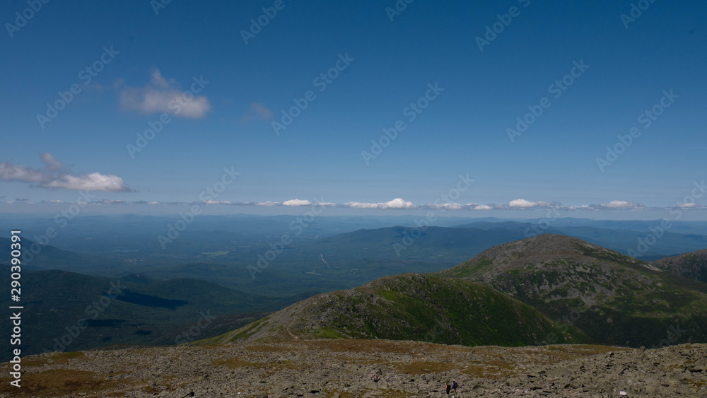 View of the White Mountains from Mount Washington summit. Vast mountain range on a sunny day