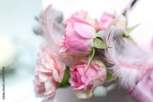 Wedding decorations. Decoration of holidays with fresh flowers. Pink roses and carnations.