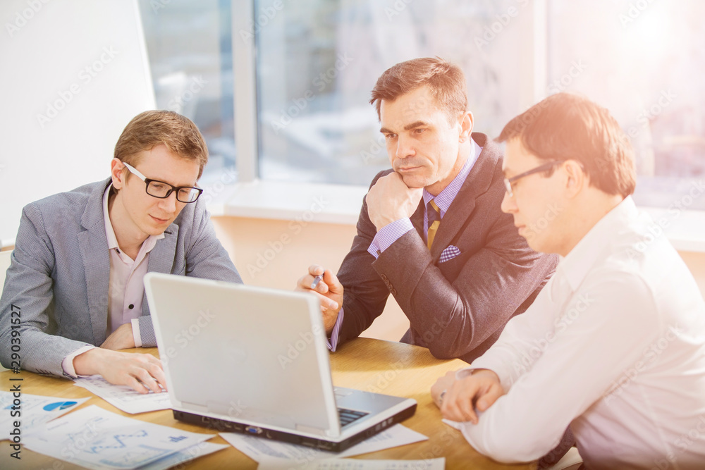 three businesspeople interacting at meeting three businesspeople interacting at meeting