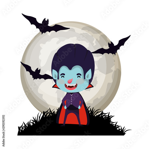 boy with dracula costume and bats flying in cemetery