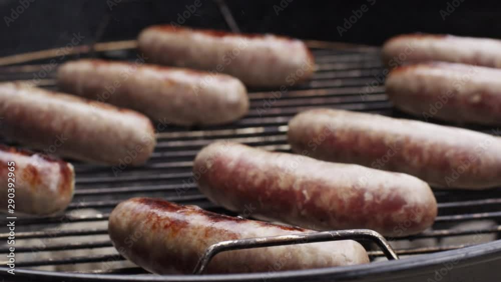 Slow motion, grilling sausage on coal grill Slow motion, grilling sausage on coal grill