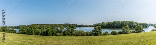 a panoramic landscape with fields and lakes in Denmark
