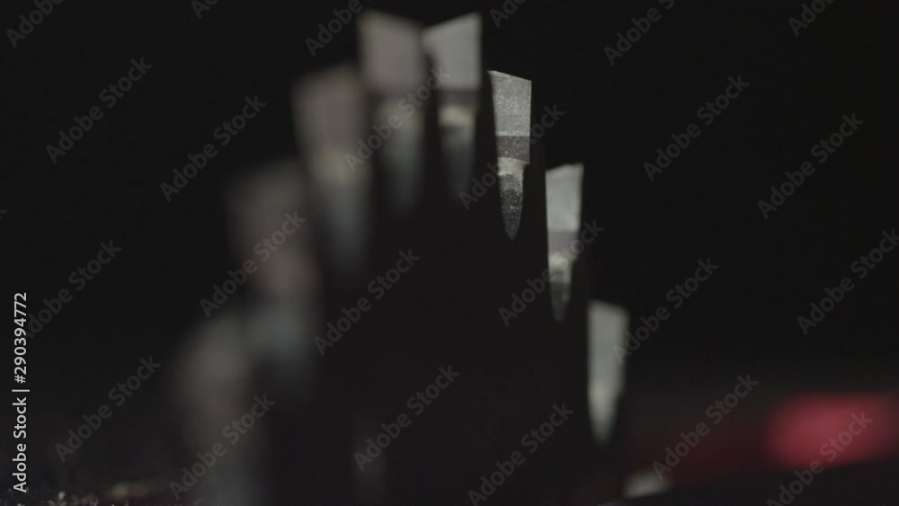Close up, table saw and saw teeth Close up, table saw and saw teeth