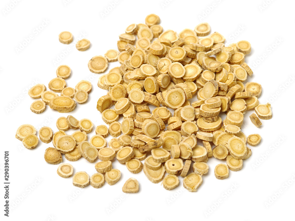 Chinese Herbal medicine - Astragalus slices, Huang Qi (Astragalus propinquus) on white background Chinese Herbal medicine - Astragalus slices, Huang Qi (Astragalus propinquus) on white background
