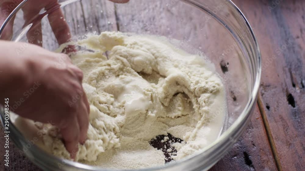 Slow motion, mixing ingredients in mixing bowl Slow motion, mixing ingredients in mixing bowl