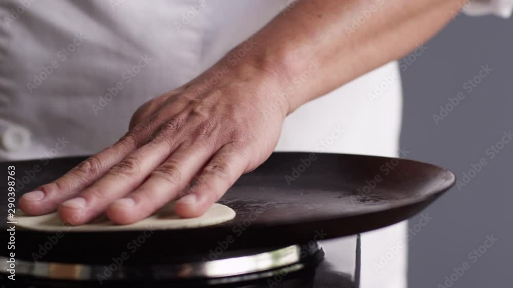 Slow motion close up, tortilla on stovetop Slow motion close up, tortilla on stovetop
