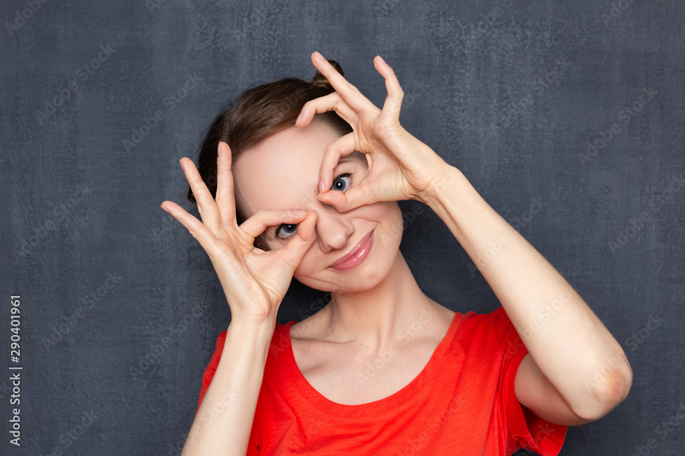 Portrait of happy cute girl showing mask with hands Portrait of happy cute girl showing mask with hands