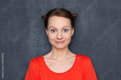 Portrait of cute and surprised girl with funny hairstyle © Andrei Korzhyts