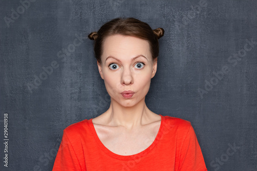 Portrait of surprised girl with funny hairstyle © Andrei Korzhyts