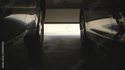 Garage door opening and man walking to car