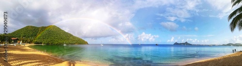 panorama plage paradisiaque avec arc-en-ciel photo