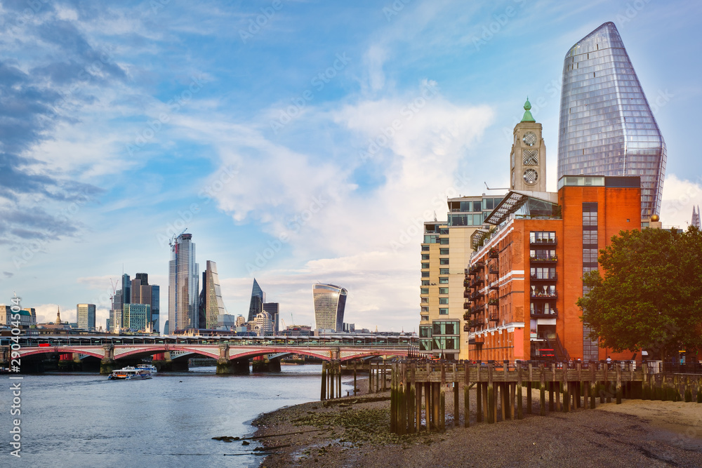 London at sunset with riverside buildings, Blackfriars Bridge and the City of London