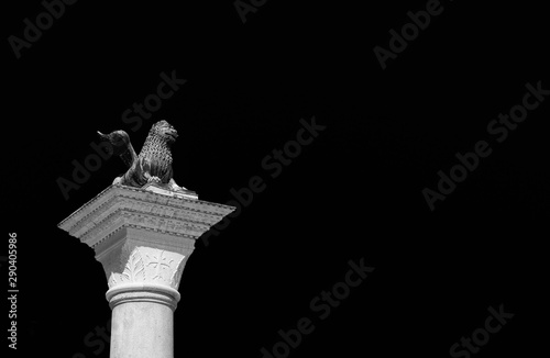 Saint Mark Lion ancient bronze statue at the top of the medieval column, erected in 1172. Symbol of the old Republic of Venice (Black and White copy space)