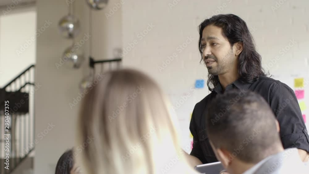 Creative millennial business people talking in meeting