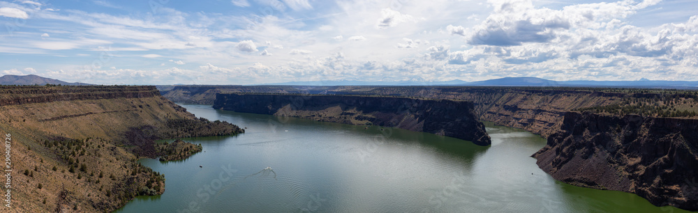 Beautiful Panoramic View of The Cove Palisades State Park during a cloudy and sunny summer day. Taken in Oregon, United States of America. Beautiful Panoramic View of The Cove Palisades State Park during a cloudy and sunny summer day. Taken in Oregon, United States of America.