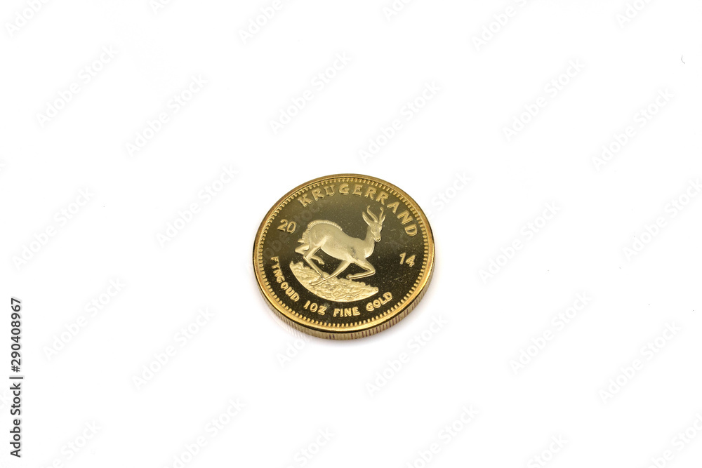A close up image of a shiny gold, South African krugerrand coin close up on a white background A close up image of a shiny gold, South African krugerrand coin close up on a white background
