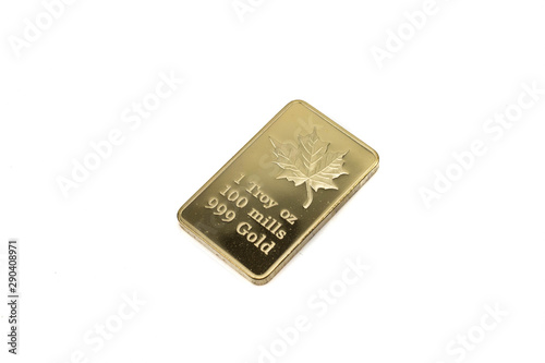 A close up image of a shiny gold, Canadian ingot, close up, isolated on a white background