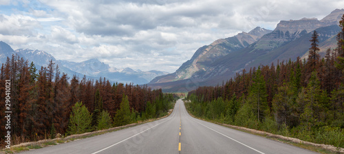 Panoramic View of a Scenic road in the Canadian Rockies during a vibrant sunny and cloudy summer morning. Taken in Icefields Parkway, Jasper National Park, Alberta, Canada.