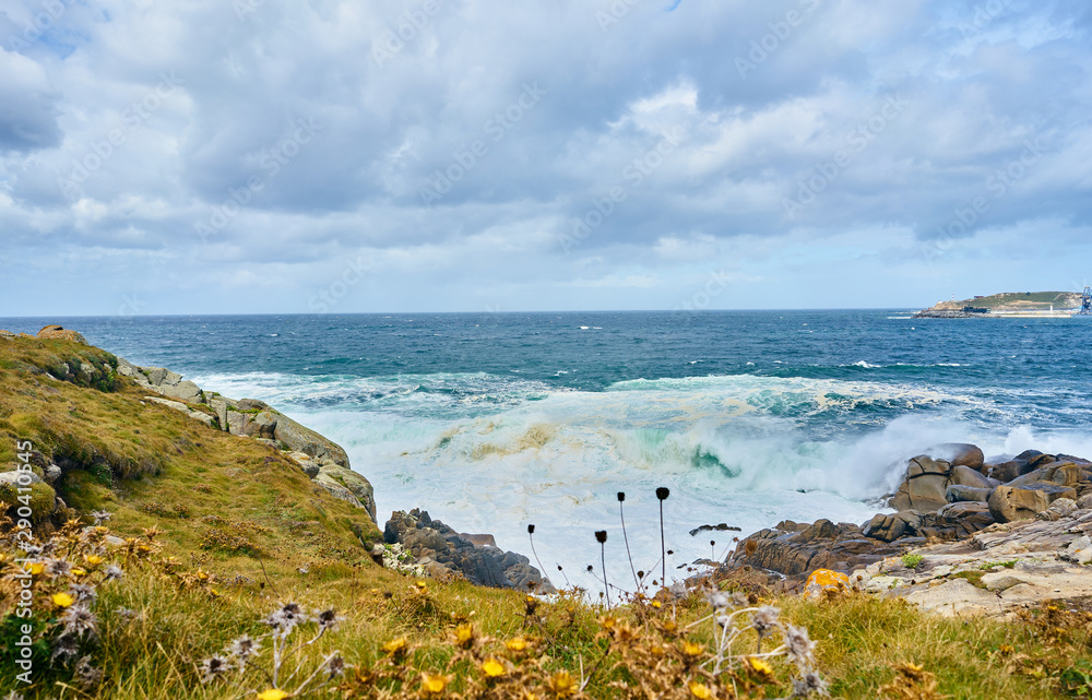 Galician seascape in Coitelada, Ares, La Coruña, Spain. Sea with a lot of waves breaking on the rocks