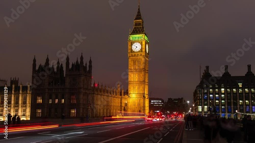 Time lapse of Palace of Westminster clock tower and traffic on bridge