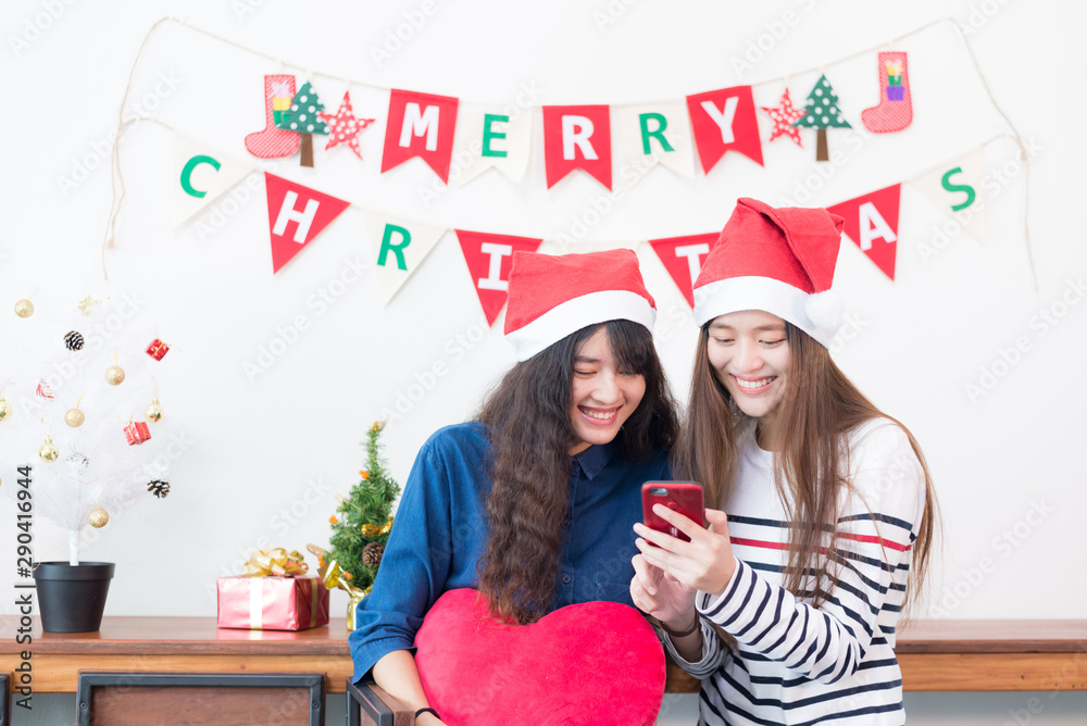 Young asian woman shopping online on a smartphone for buy christmas gift at home. Young asian woman shopping online on a smartphone for buy christmas gift at home.