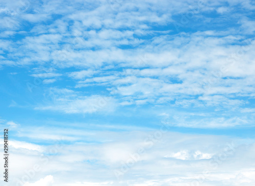 blue sky background with tiny clouds © detshana