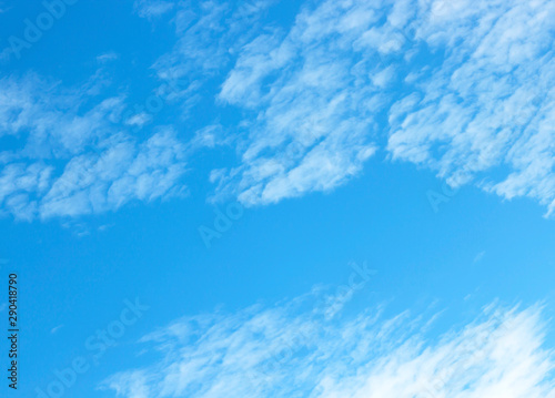 blue sky background with tiny clouds