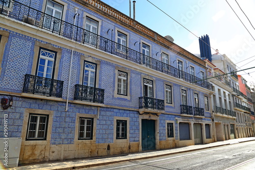 Traditional colorful buildings with azulejo tiles facade in the old Lisbon neighborhoods Portugal