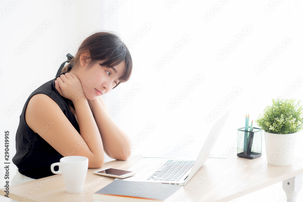 Business woman overwork on laptop computer and neck pain with at work in office, girl stress and illness chronic with office syndrome, health and emotion concept. Business woman overwork on laptop computer and neck pain with at work in office, girl stress and illness chronic with office syndrome, health and emotion concept.