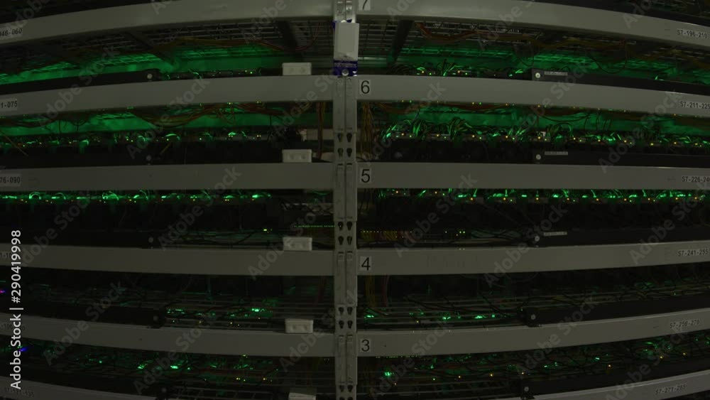 Bitcoin Farm Fish-eye Wide Angle of Server Rack with Blinking Lights Bitcoin Farm Fish-eye Wide Angle of Server Rack with Blinking Lights