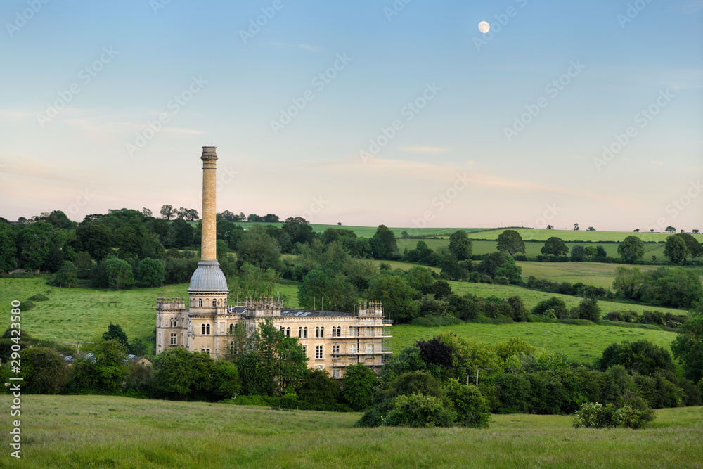 Bliss Tweed Mill in Chipping Norton England a previous wool mill for tweed converted to apartments in the evening under a gibbous moon