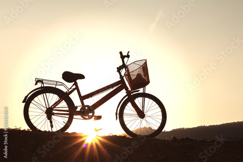 bike on the mountain sunset background
