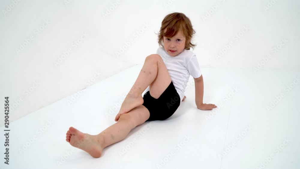 Charming little girl doing gymnastic exercises in the studio on Charming little girl doing gymnastic exercises in the studio on