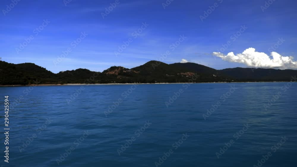 Looking at the sea, island and sky from the sea. (Slow motion - Angle 017) Looking at the sea, island and sky from the sea. (Slow motion - Angle 017)
