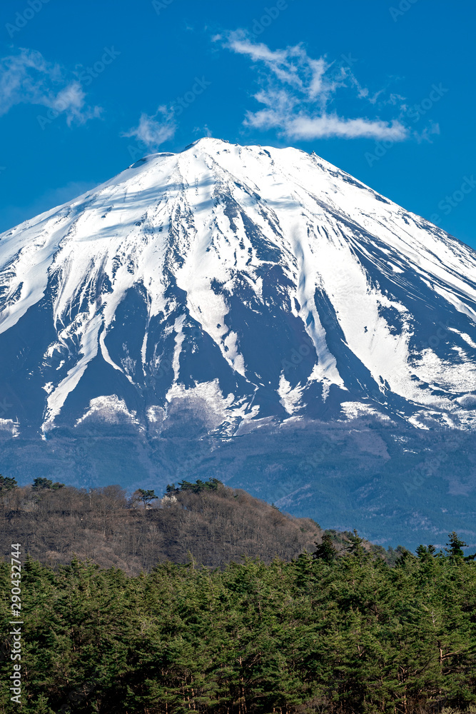 Top Mountain Fuji is covered with snow and blue sky background.