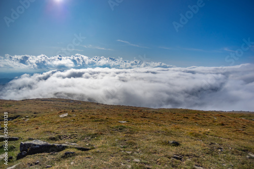 Mountains covered in fog in autumn day