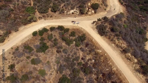 Aerial Drone 3 Horses Walking Dirt Path photo